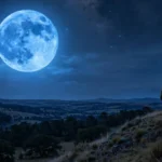 A rare large blue moon glowing over a quiet night landscape, a lone observer on a hill, stars visible, photorealistic style.